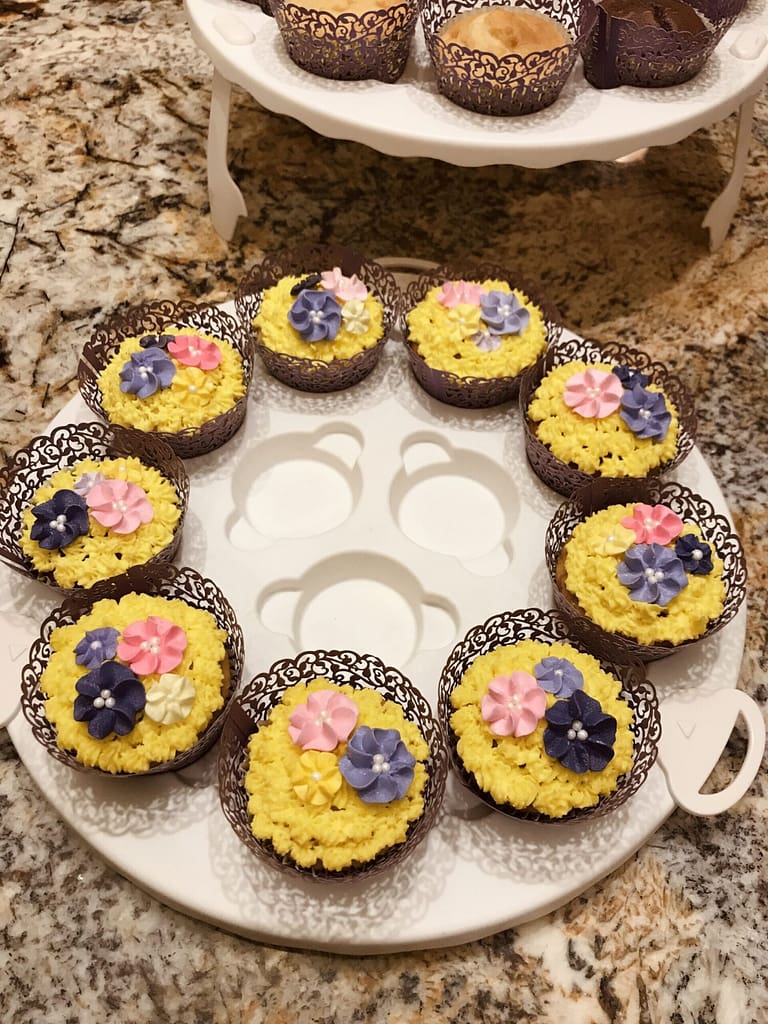RAPUNZEL PARTY cupcakes yellow buttercream and flowers Tangled