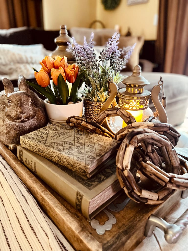 tulips lavender centerpiece coffee table ottoman stacked book boxes rabbit Spring Easter Decor with Lantern wood ring chain link decor gg collection heritage